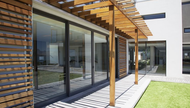 Pergola covering patio of modern house