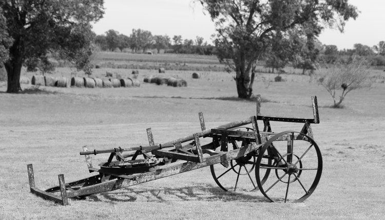 A black and white photo of a farm tool in the late 1800s.