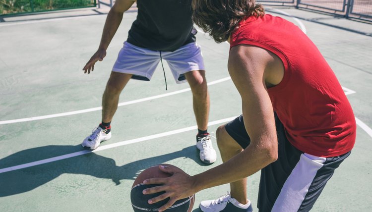 Men playing basketball