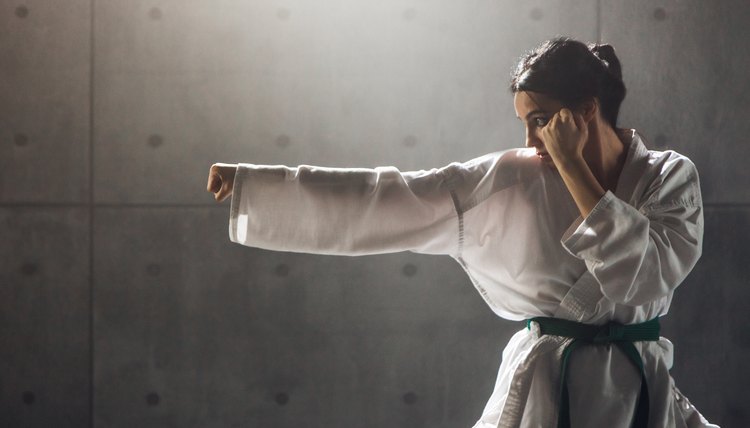 Woman in kimono practicing karate