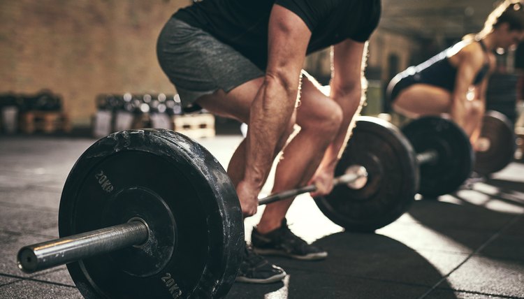 Strong man doing deadlift training in gym