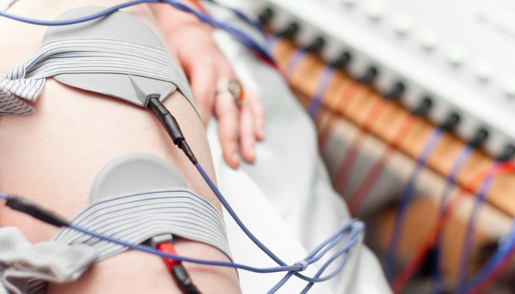 woman wired up on electrostimulation device