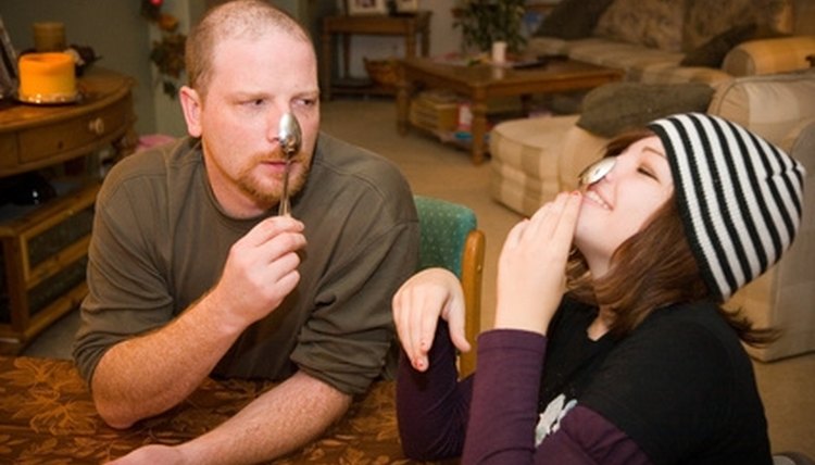 Example: The spoon balanced on her uncle's nose.