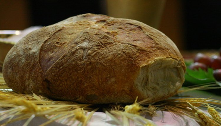 Eucharistic ministers distribute the bread and the wine at Mass.