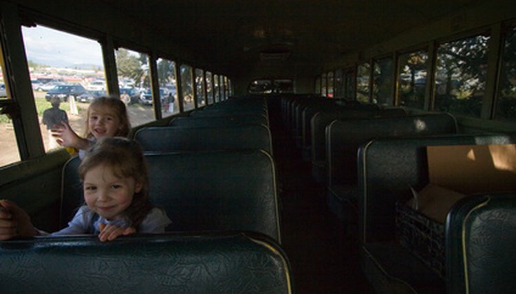 Passengers must all sit while the school bus is in motion.