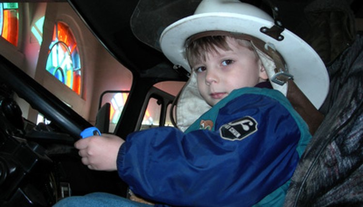Little boy with a fireman hat on