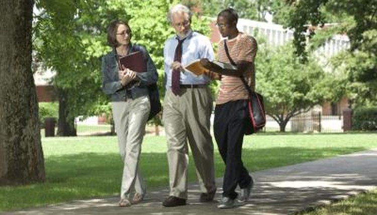 professor speaking with two of his students outside of class
