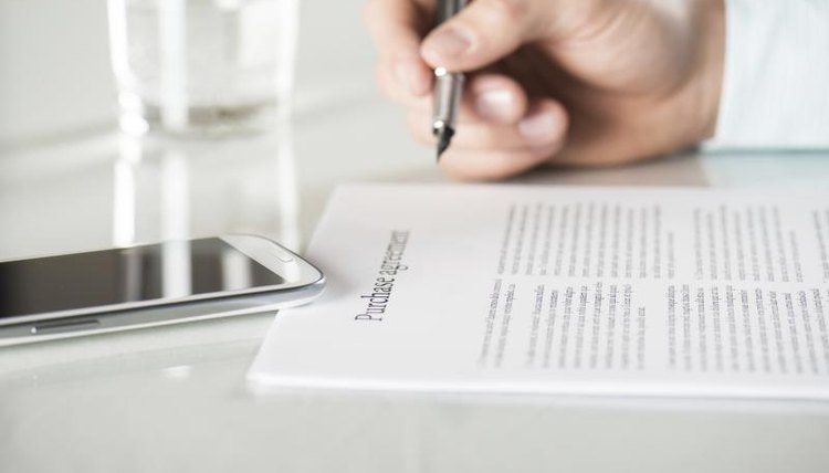 Man signing document