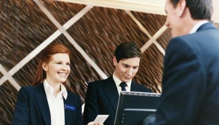 Woman working at hotel front desk