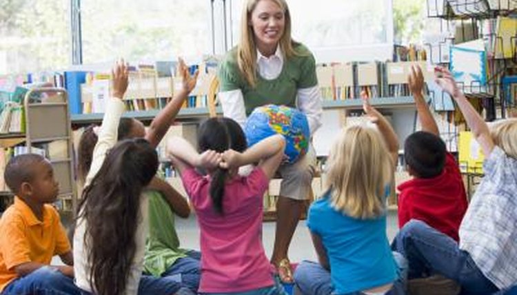 teacher holding globe