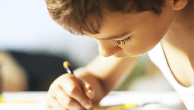 Child drawing on paper