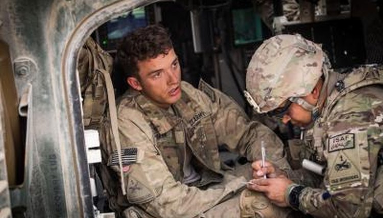 Military medic tends to a soldier.