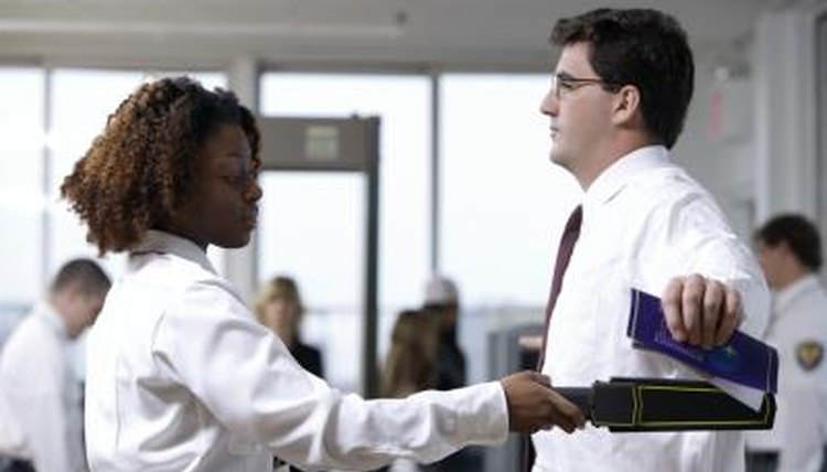 Man in airport security scanning area