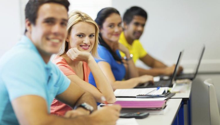 Students smiling in communications class