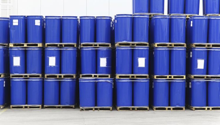 A stack of metal barrels in a warehouse