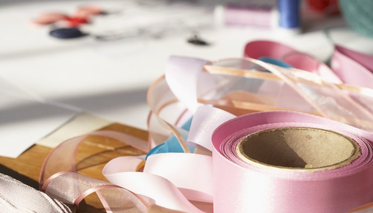 Turn ribbon into a pretty bow to adorn Greek christening candles.