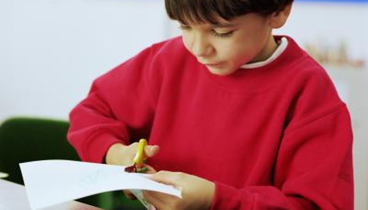 Boy cutting paper