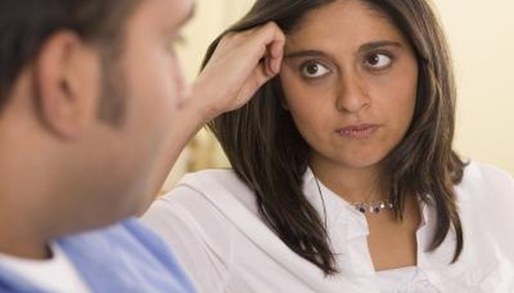 Woman looking upset with man