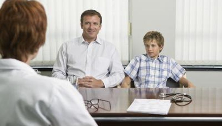 Dad with child at doctor