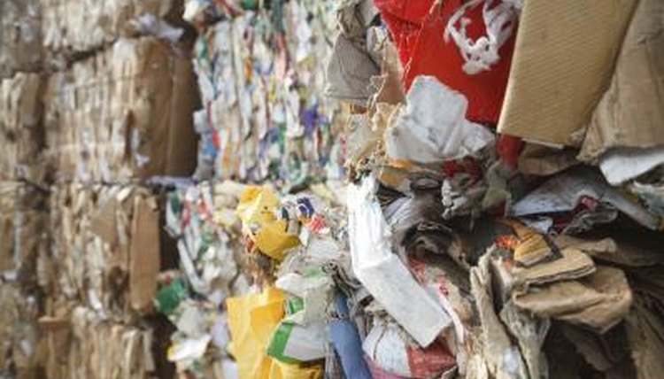 Bundles of used paper is prepared for recycling at the recycling center.
