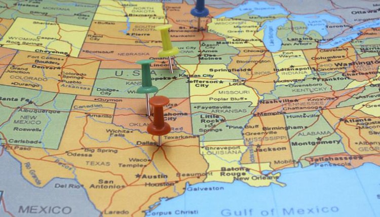 Map of the different states in the U.S. with push pins.