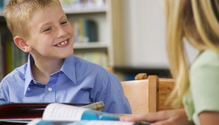 Boy talking with girl in classroom