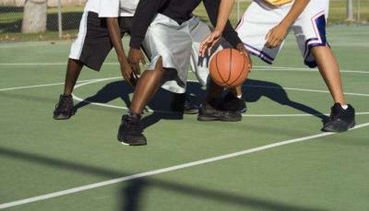 Students playing on outdoor basketball court
