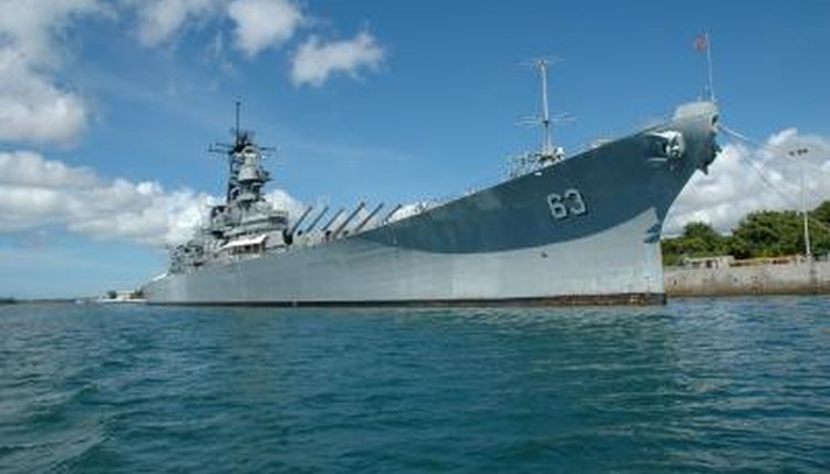 Battleships, such as the USS Missouri, carried heavy guns to attack enemy warships.