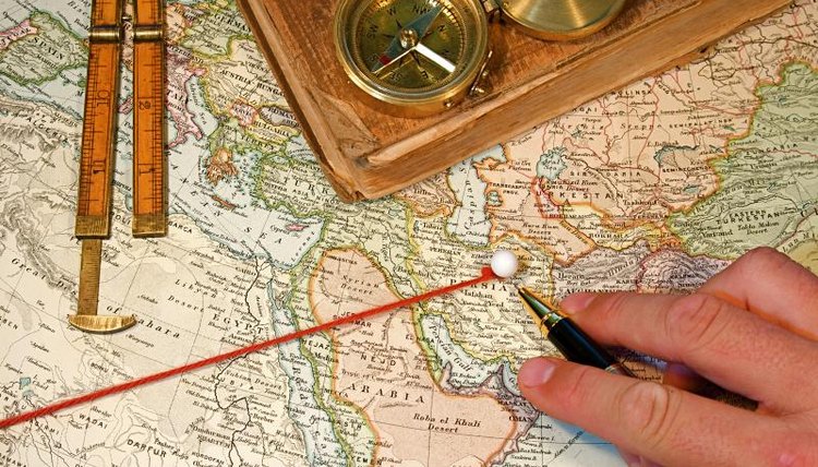 A map with yarn used for comparing distances.