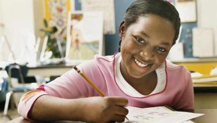 child filling out homework pass