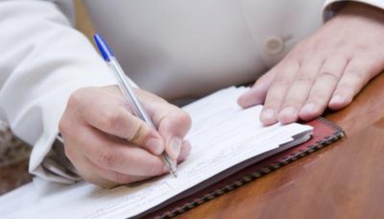 Man writing down account