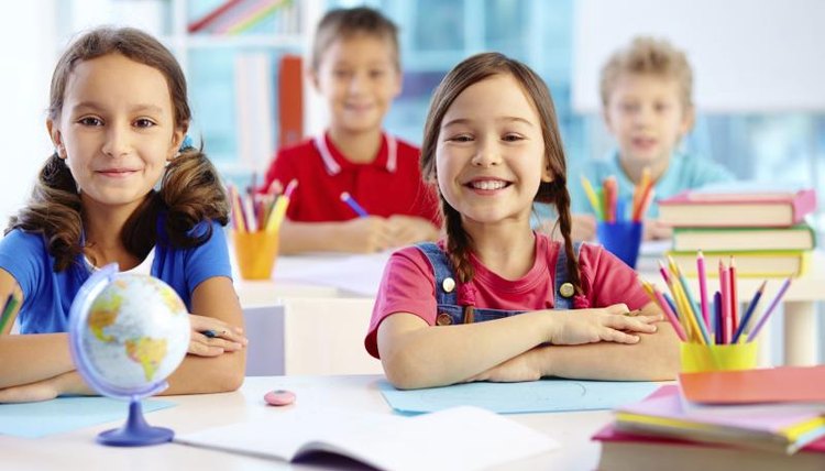 Happy preschool children in class.