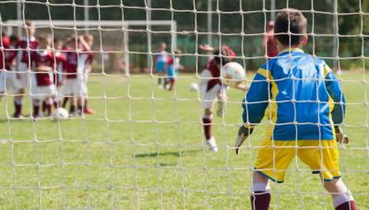 Young soccer players in action on the field.