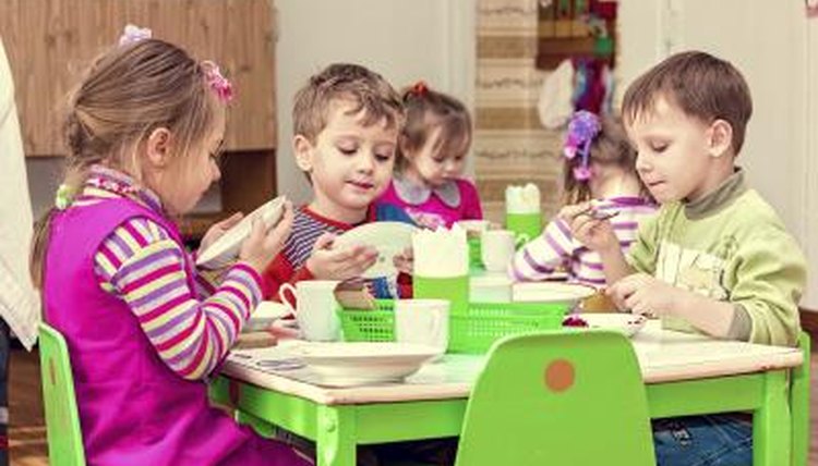A group of young kindergartners building towers.