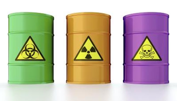 Green, orange, and purple containers with radioactive materials.