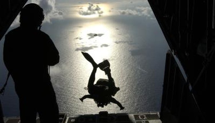 An Air Force pararescue jumper takes off from a HC-130 Hercules aircraft over the South Pacific Ocean