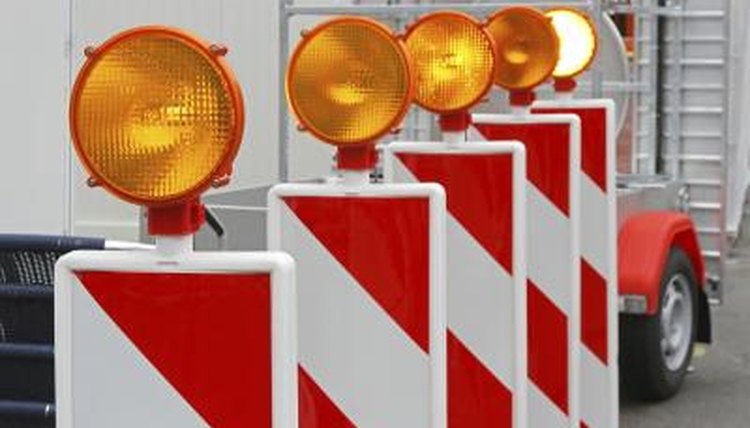 Orange signs and lights for safety.