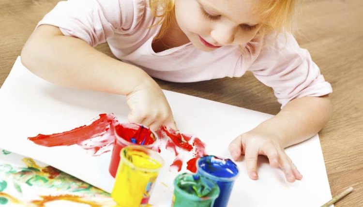 Young girl painting.