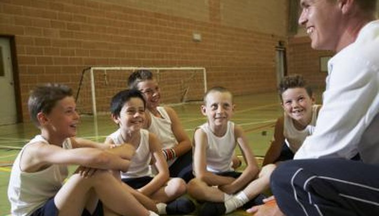 Boy sitting around PE teacher