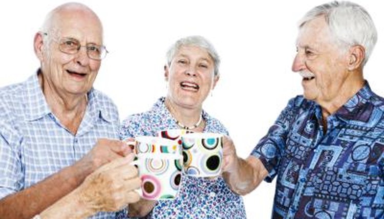 Seniors with mugs in hand.