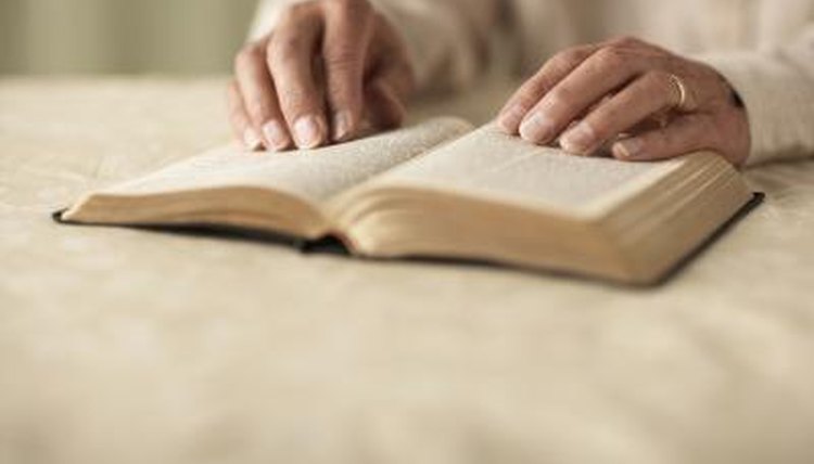 Senior man reading Bible.