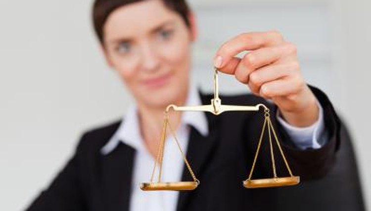 Woman holding scales, the symbol of justice.