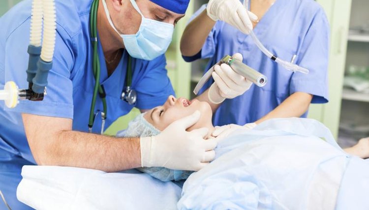 An anesthesia doctor is working with a patient.