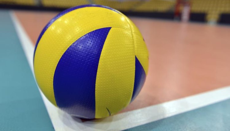 Colorful volleyball on corner of court