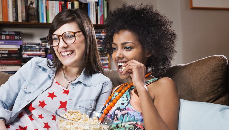 Women watching television in livingroom.