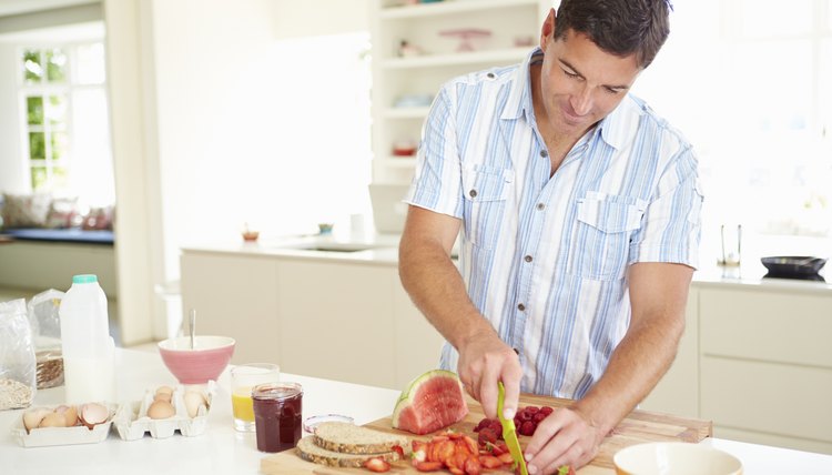 Man Preparing Healthy Breakfast In Kitchen