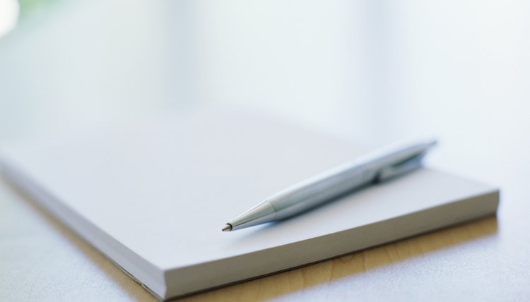 close-up of a pen on a notebook