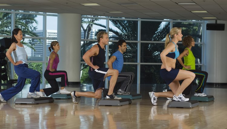 People Exercising in Step Aerobics Class