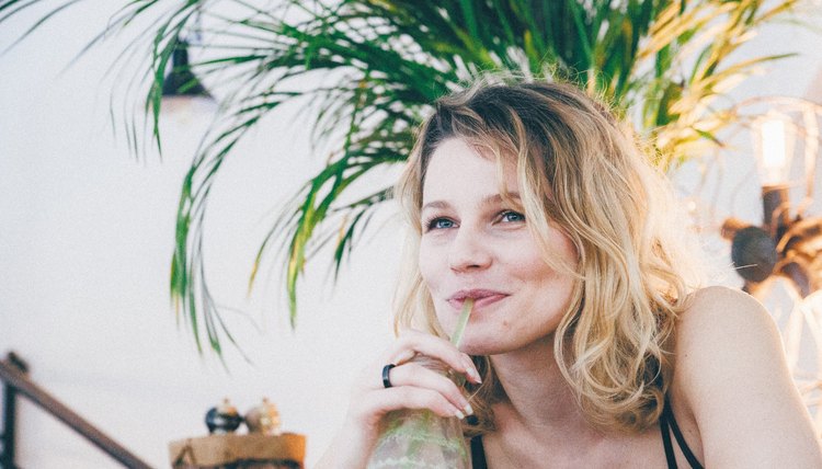 woman drinking smoothie