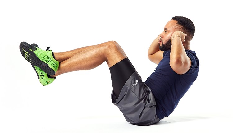 man doing elevated leg crunches